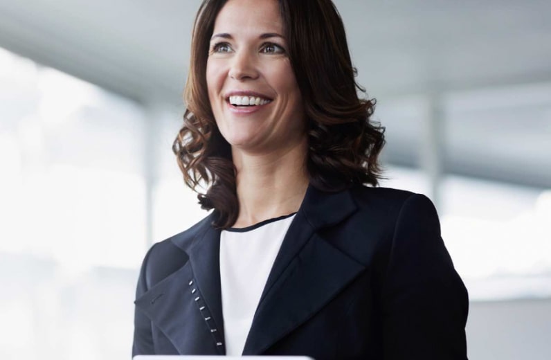 Smiling woman wearing business casual suit