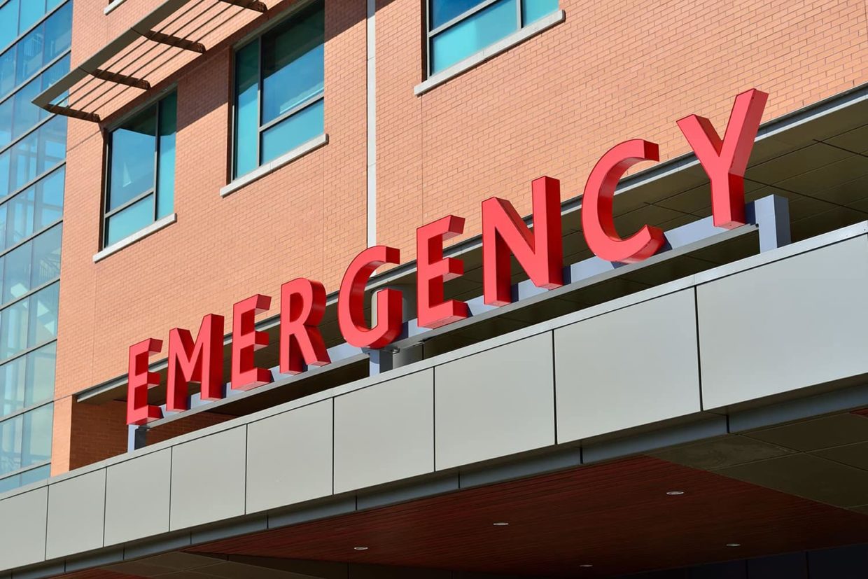 Exterior view of Emergency Room sign above hospital doors